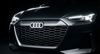 Gros plan iconique de la face avant d'une Audi 35 TDI mettant en valeur le design et l'éclairage LED.
